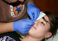 nostril piercing, I women being pierced with nose ring